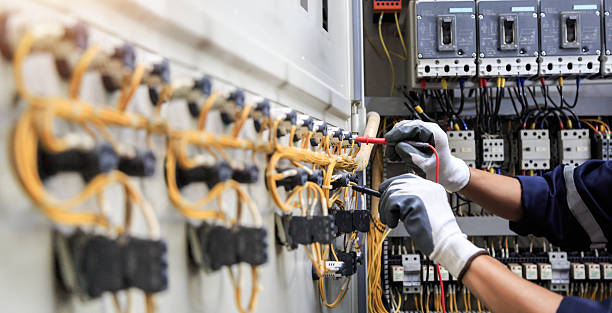 Professional Electrician technician working in Raynham Center, MA